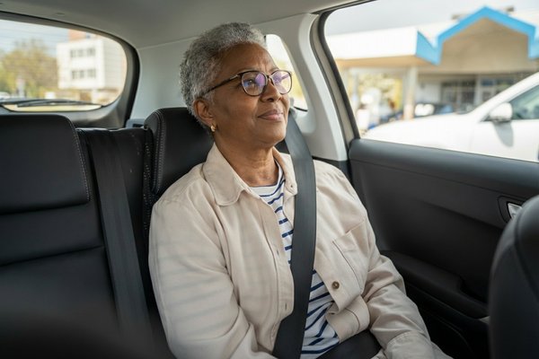 Senior patient sitting comfortably in Transit Professionals vehicle